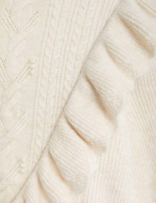 Su&eacute;ter de punto trenzado con borde festoneado