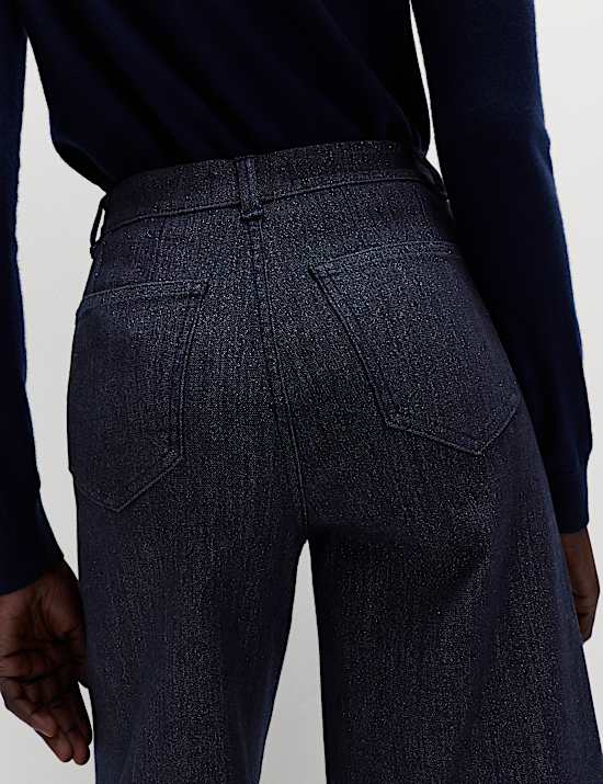 Glinsterende jeans met wijde pijpen tot op de enkel