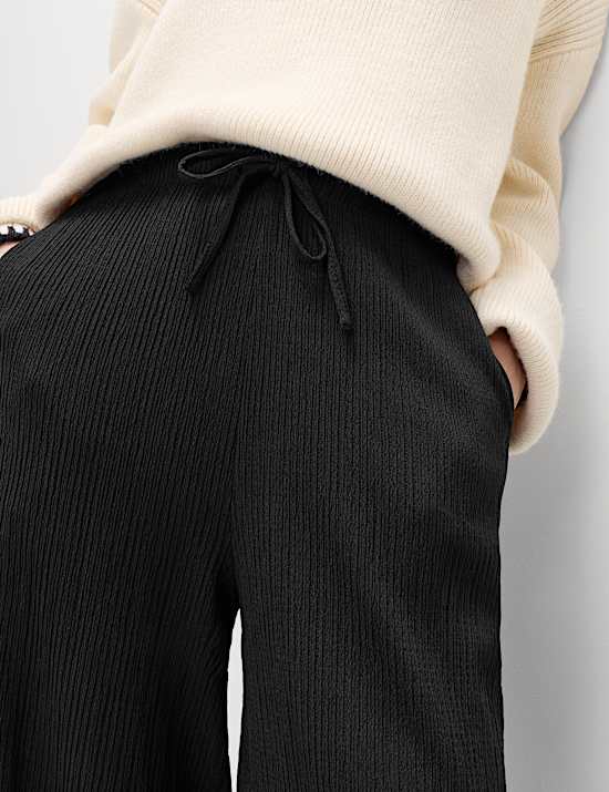 Pantalon textur&eacute; coupe carotte &agrave; taille &eacute;lastique