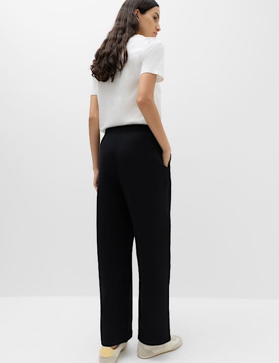 Pantalones deportivos el&aacute;sticos de corte estrecho