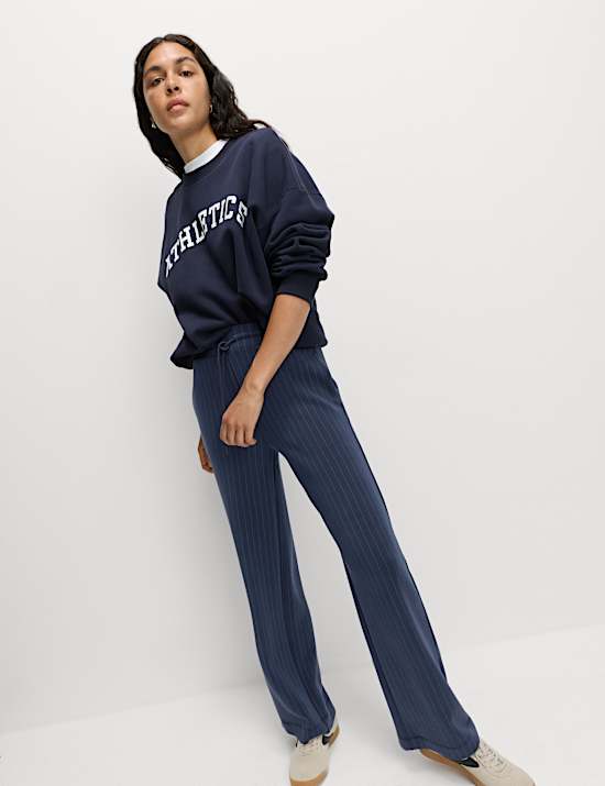 Pantalones deportivos de pernera ancha de rayas en mezcla de modal