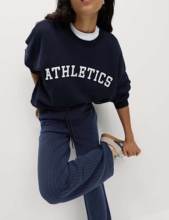 Pantalones deportivos de pernera ancha de rayas en mezcla de modal