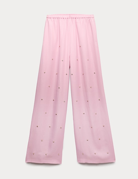 Ruimvallende, rechte broek van satijn met versiering