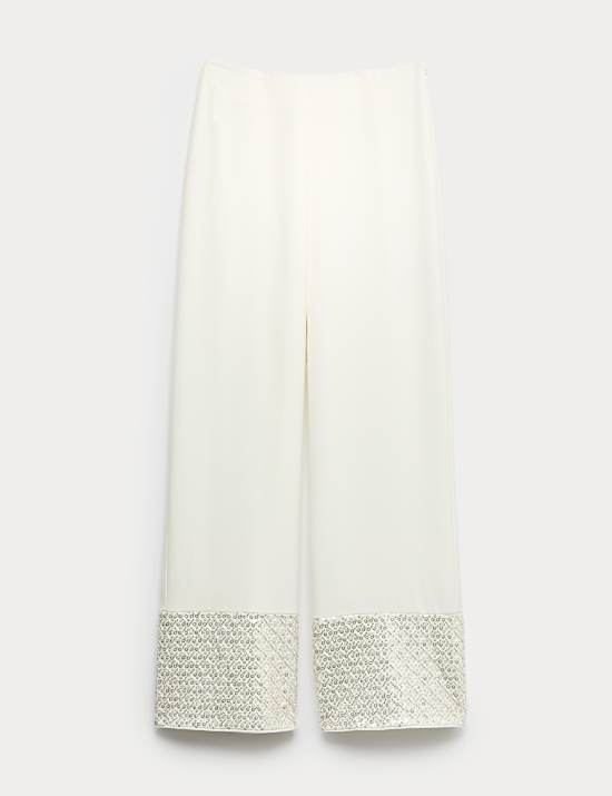 Broek met rechte pijpen versierd met pailletten op de zoom