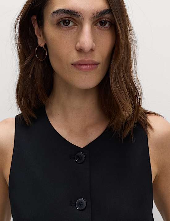 Kraagloos gilet met knoopsluiting