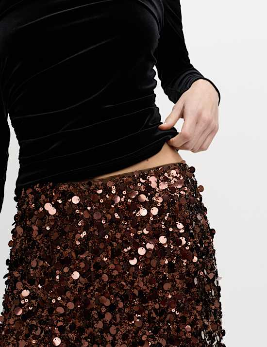 Broek met lovertjes en wijde pijpen