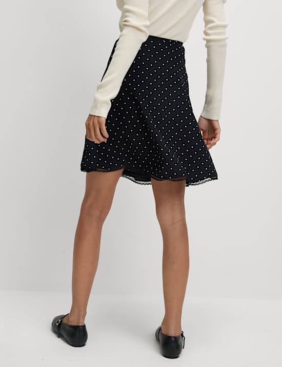 Minijupe portefeuille coupe courte taille haute à pois