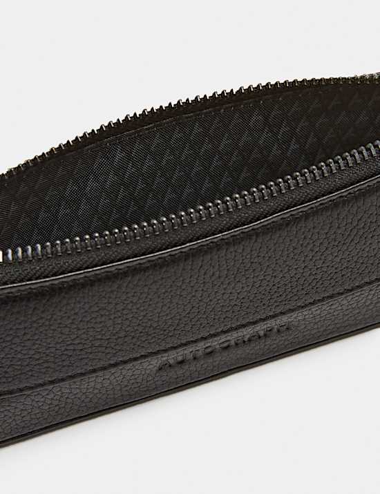 Trousse en cuir &agrave; fermeture zipp&eacute;e