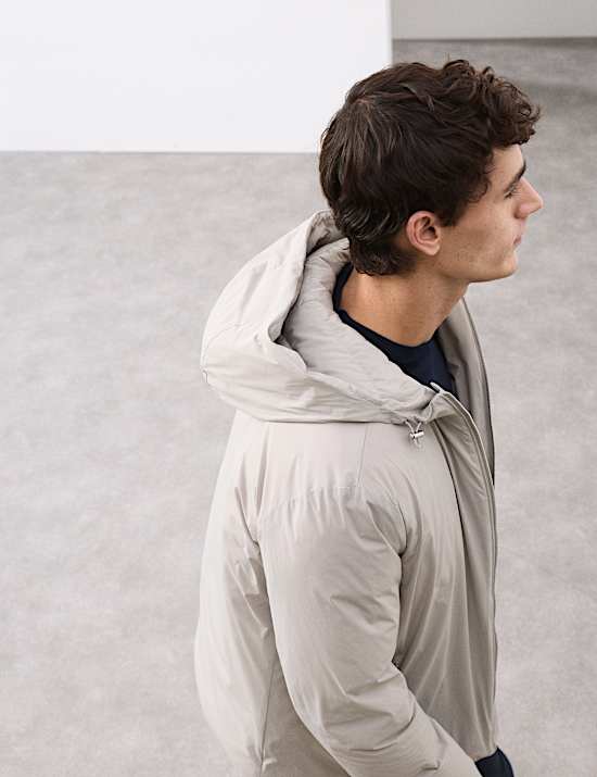 Veste molletonn&eacute;e, garnie de plumes et de duvet