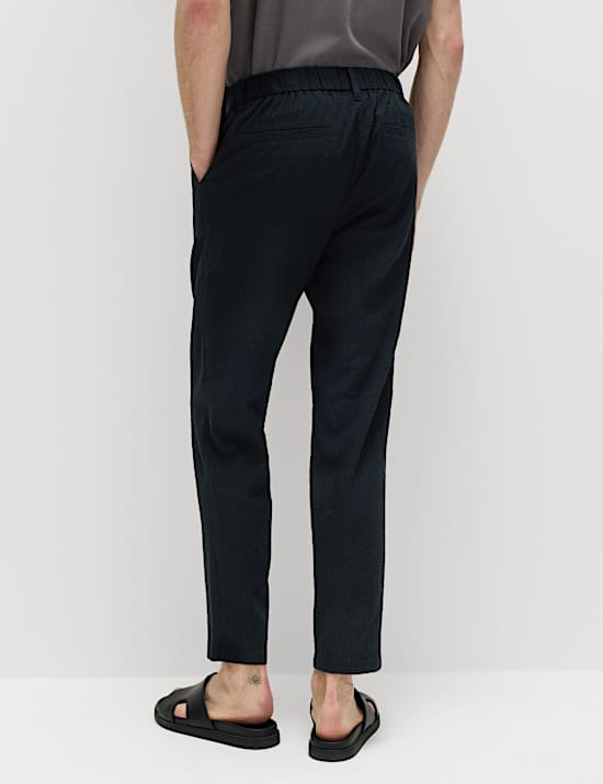 Pantalones tapered de sirsaca de algod&oacute;n