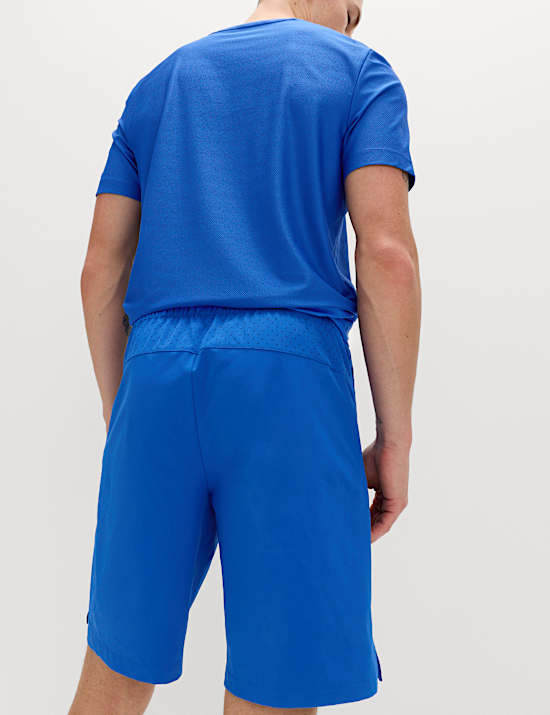 Pantalones cortos deportivos de corte est&aacute;ndar el&aacute;sticos de 23 cm