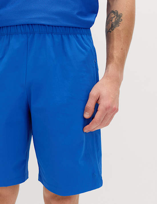 Pantalones cortos deportivos de corte est&aacute;ndar el&aacute;sticos de 23 cm