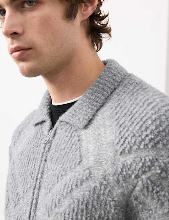 Veste en laine mérinos bouclée avec fermeture zippée