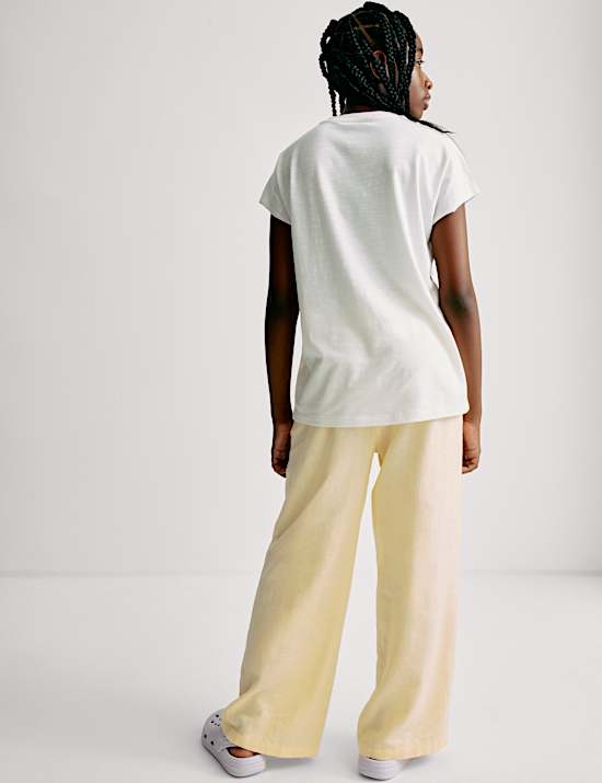 מכנסיים בגזרת רגל רחבה מבד עשיר בפשתן (6-‏16 שנים)