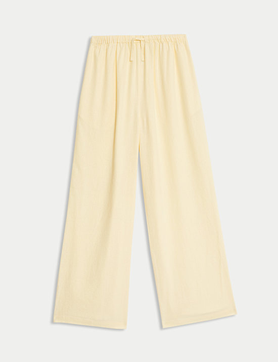 מכנסיים בגזרת רגל רחבה מבד עשיר בפשתן (6-‏16 שנים)