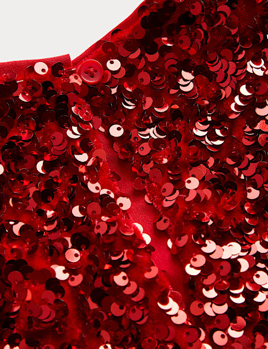 חולצה עם שרוולים מתנפנפים ופאייטים (2‏-10 שנים)