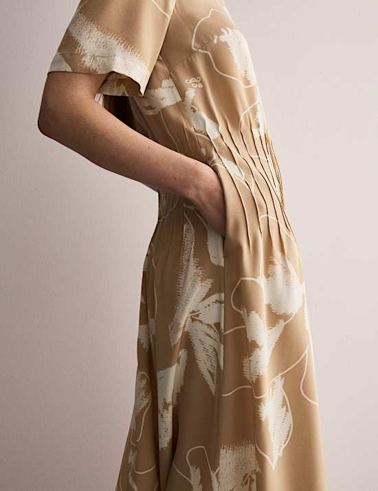 Vestido a media pierna 100 % seda con cintura y estampado floral