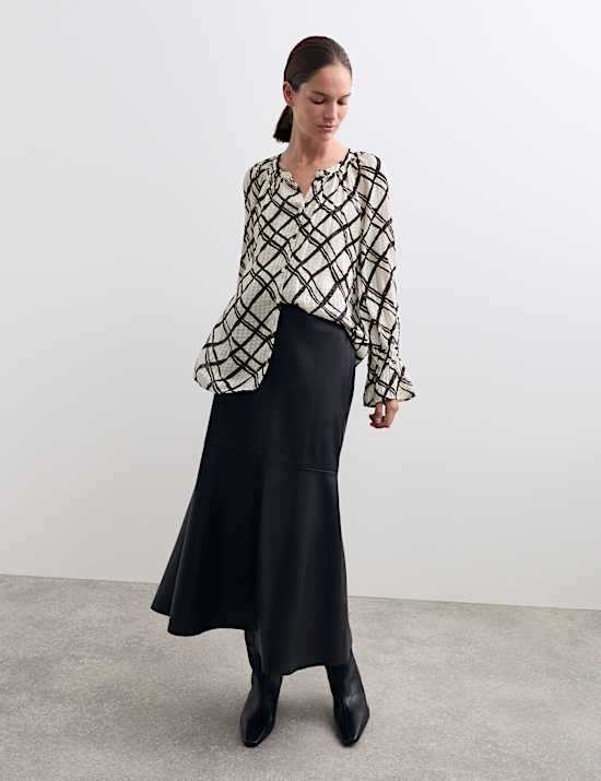 Blusa con cuello redondo a rayas