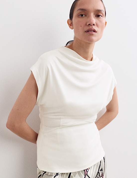 Top z luźnym golfem