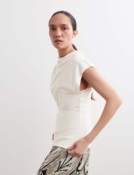 Top z luźnym golfem