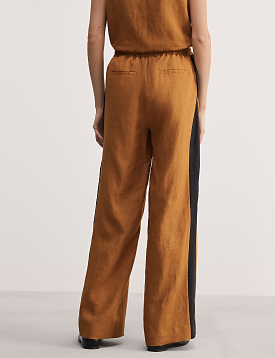 Broek van zuiver linnen met zijstreep en wijde pijpen