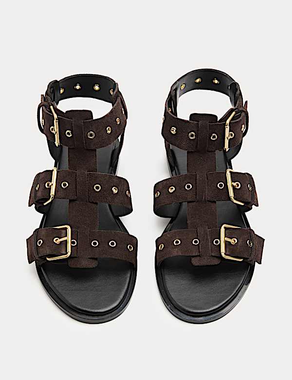 Platte gladiatorsandalen van su&egrave;de met oogjes - NL