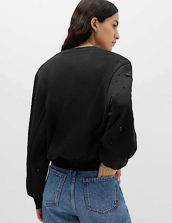 Sudadera de algod&oacute;n con adorno - US