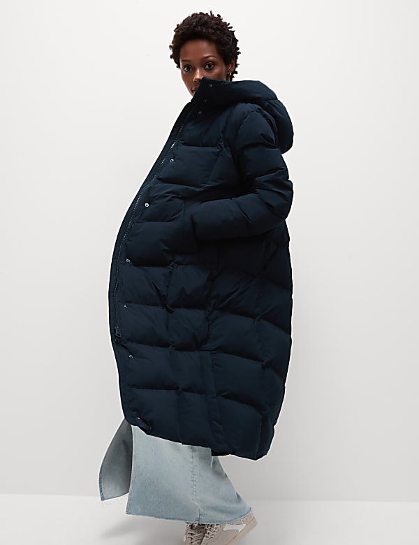 Manteau molletonné coupe longue à capuche, doté de la technologie Thermowarmth™ - BE