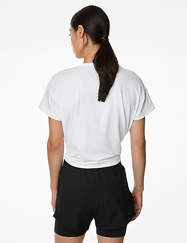 Ruimvallende korte top met lage ronde hals en gestrikte voorzijde - NL