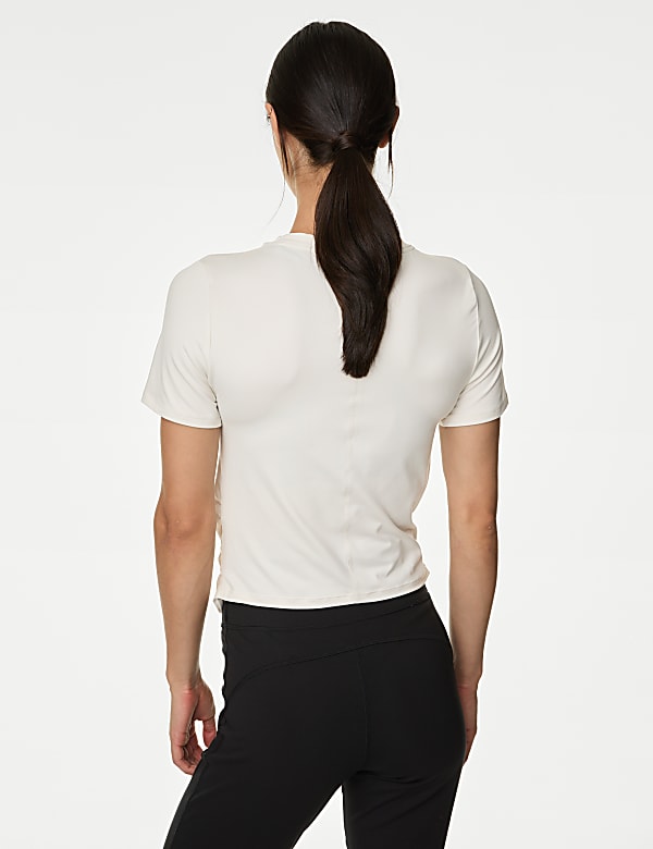 Yoga-T-shirt met lage ronde hals en wikkelstijl voorop - NL