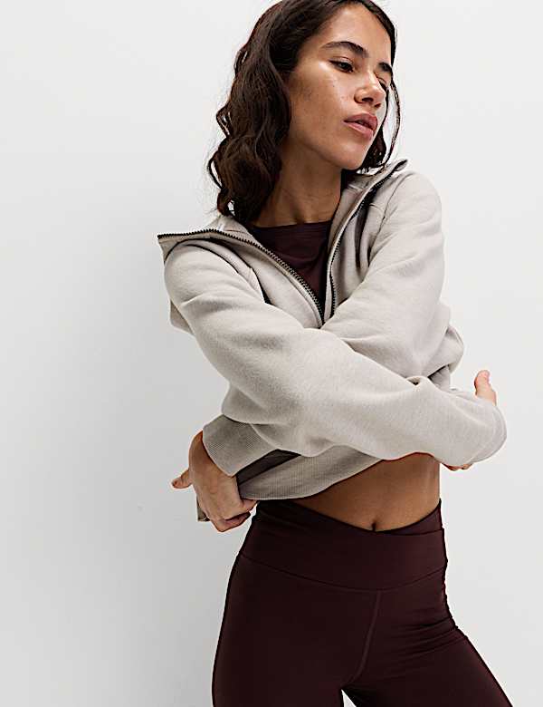 Ruimvallende, katoenrijke hoodie met korte rits - BE