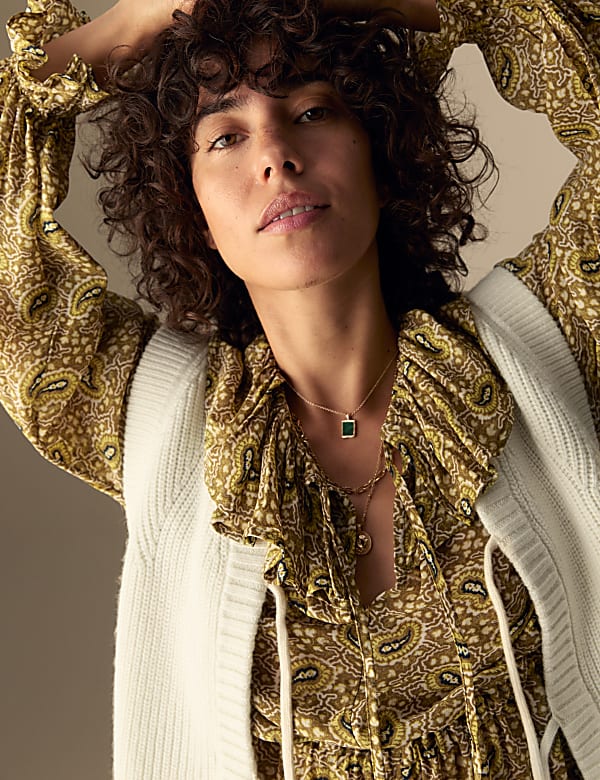 Geribde poncho met wol en strik aan de voorkant - BE