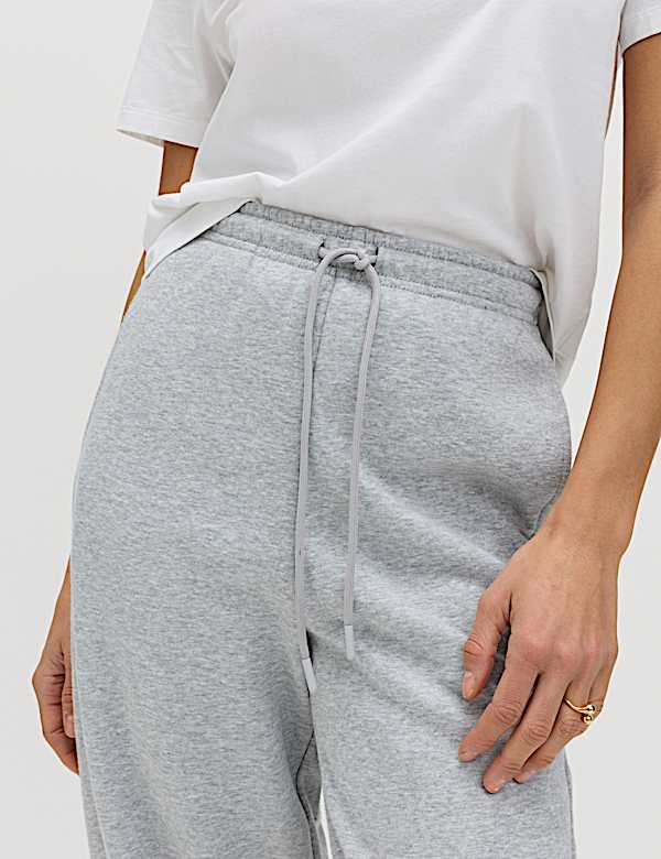 Tepl&aacute;ky ke kotn&iacute;kům s nohavicemi mrkv&aacute;čov&eacute;ho stylu a vysok&yacute;m pod&iacute;lem bavlny - CZ