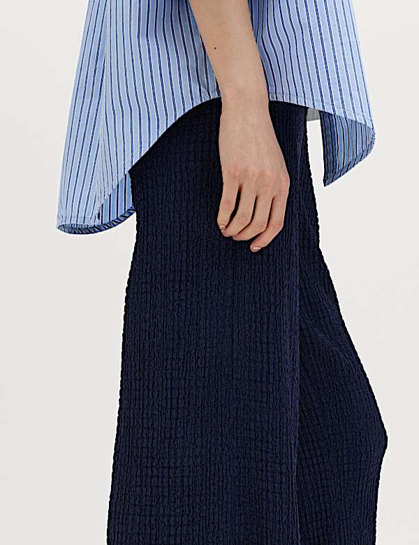 Pantalones de pata ancha con goma texturizados - US