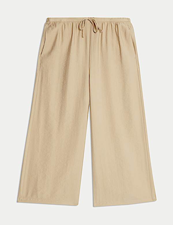 Kortere lyocell-rijke broek met wijde pijpen - NL