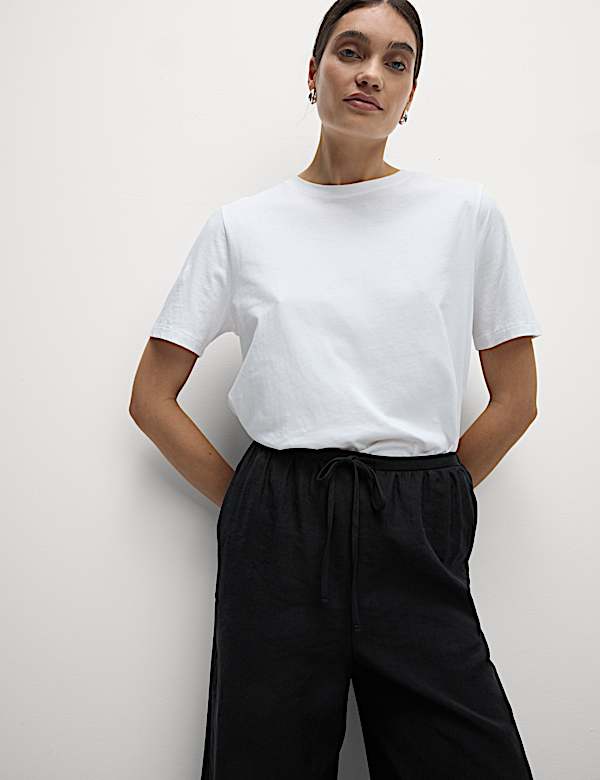 Kortere lyocell-rijke broek met wijde pijpen - NL