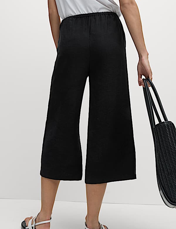 Kortere lyocell-rijke broek met wijde pijpen - NL