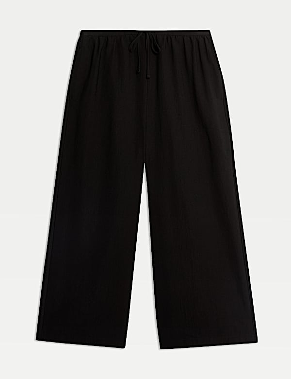 Kortere lyocell-rijke broek met wijde pijpen - NL