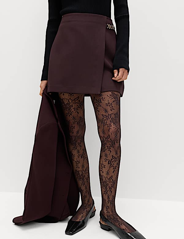 Minifalda de corte en A con detalle de cadena - US