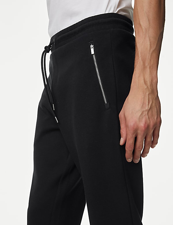 Jogging en coton m&eacute;lang&eacute; &agrave; poches zipp&eacute;es et ourlet resserr&eacute; - BE