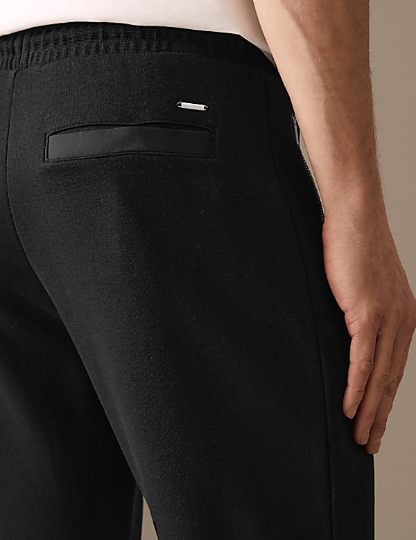 Jogging en coton m&eacute;lang&eacute; &agrave; poches zipp&eacute;es et ourlet resserr&eacute; - BE