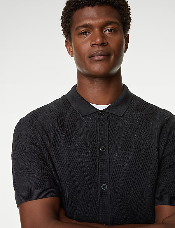 Black knitted polo shirt on sale