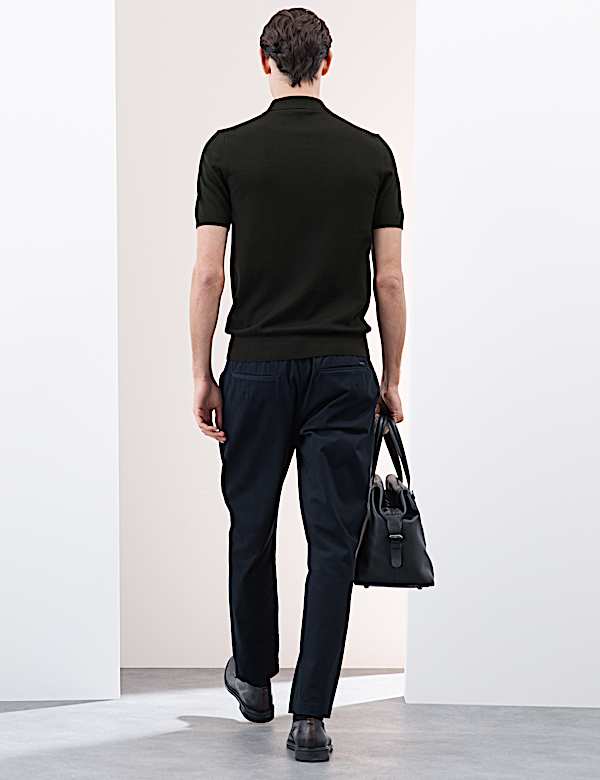 Gestricktes Poloshirt aus reiner, extrafeiner Merinowolle - AT