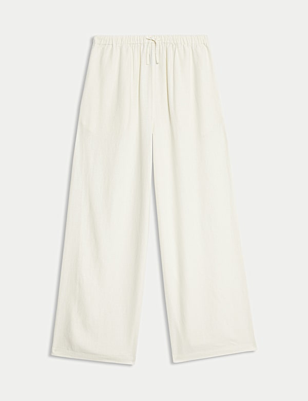 מכנסיים בגזרת רגל רחבה מבד עשיר בפשתן (6-‏16 שנים) - IL