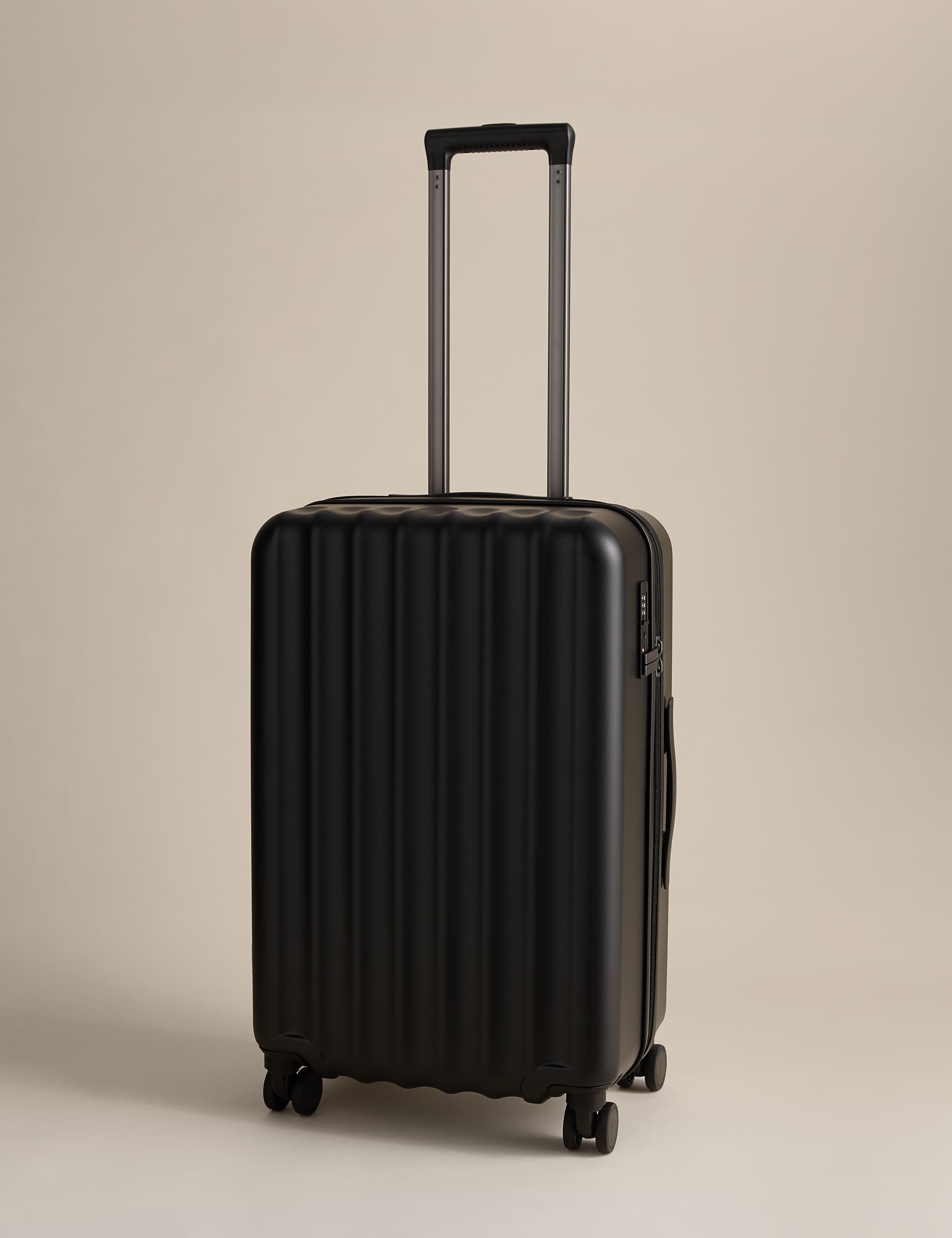 Mykonos 4 Wheel Hard Shell Medium Suitcase in black or charcoal - free click and collect