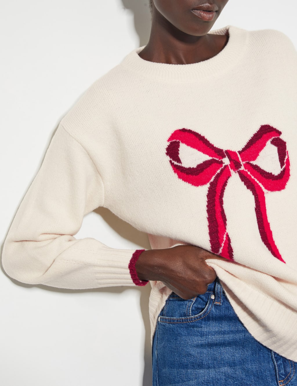 White jumper with red bow clearance