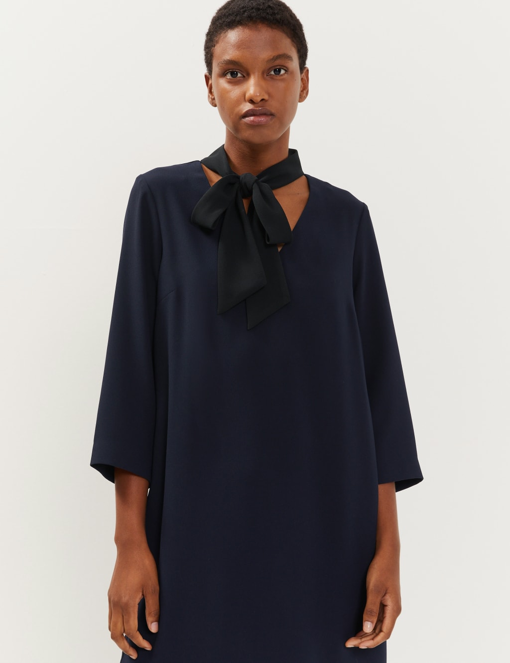 Dress with bow tie at neck store