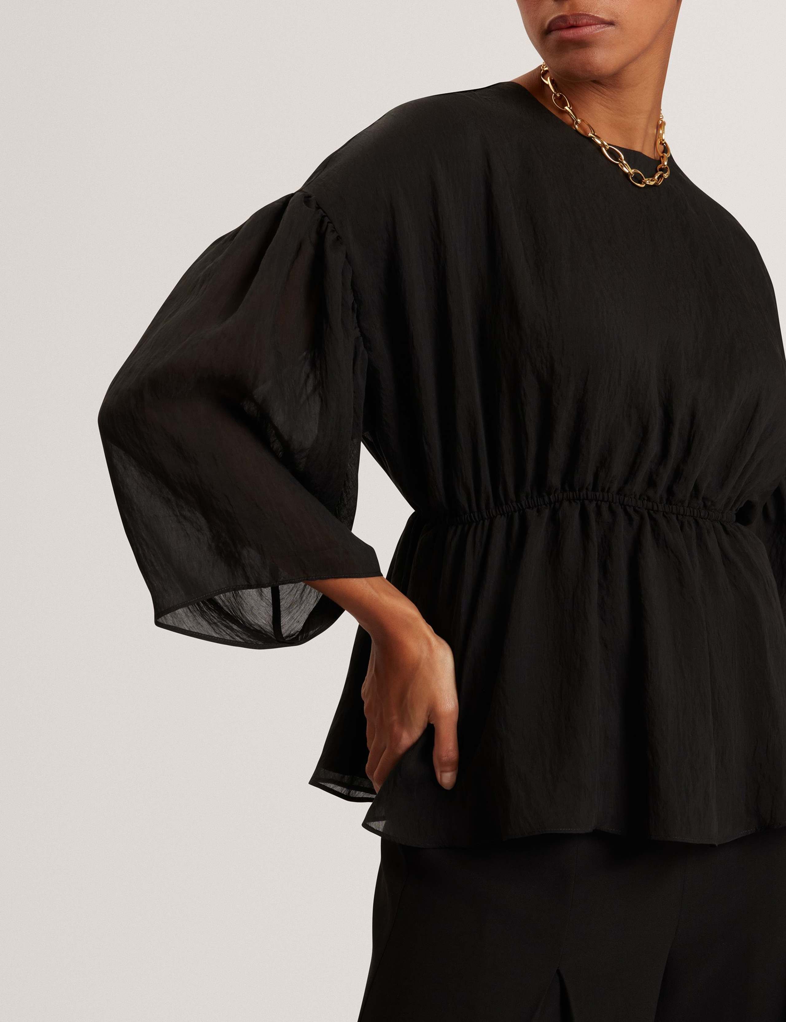 Lyocell Rich Puff Sleeve Peplum Top 4 of 7