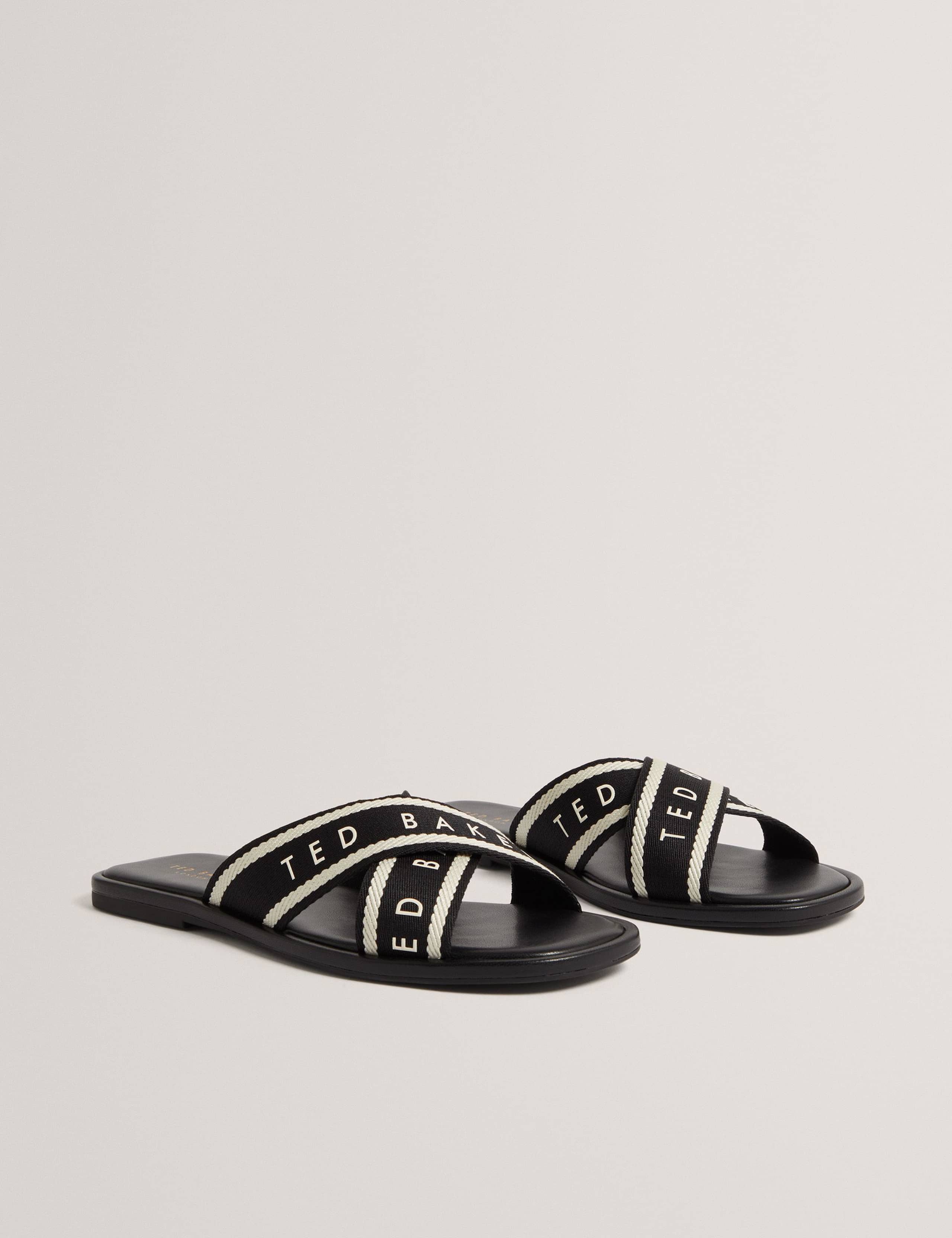Logo Webbing Crossover Strap Flat Sandals 1 of 4