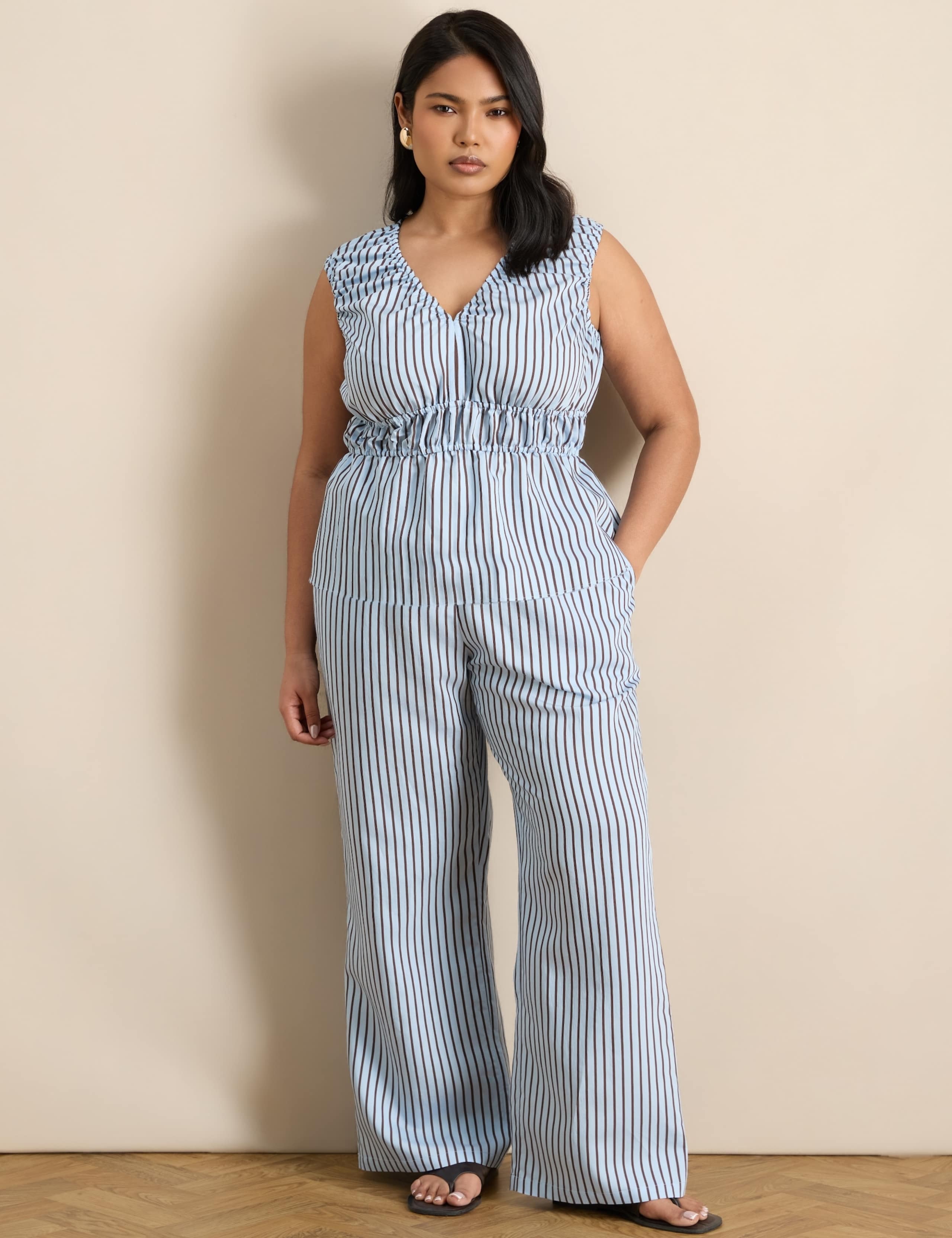 Modal Rich Striped V-Neck Peplum Top 1 of 6